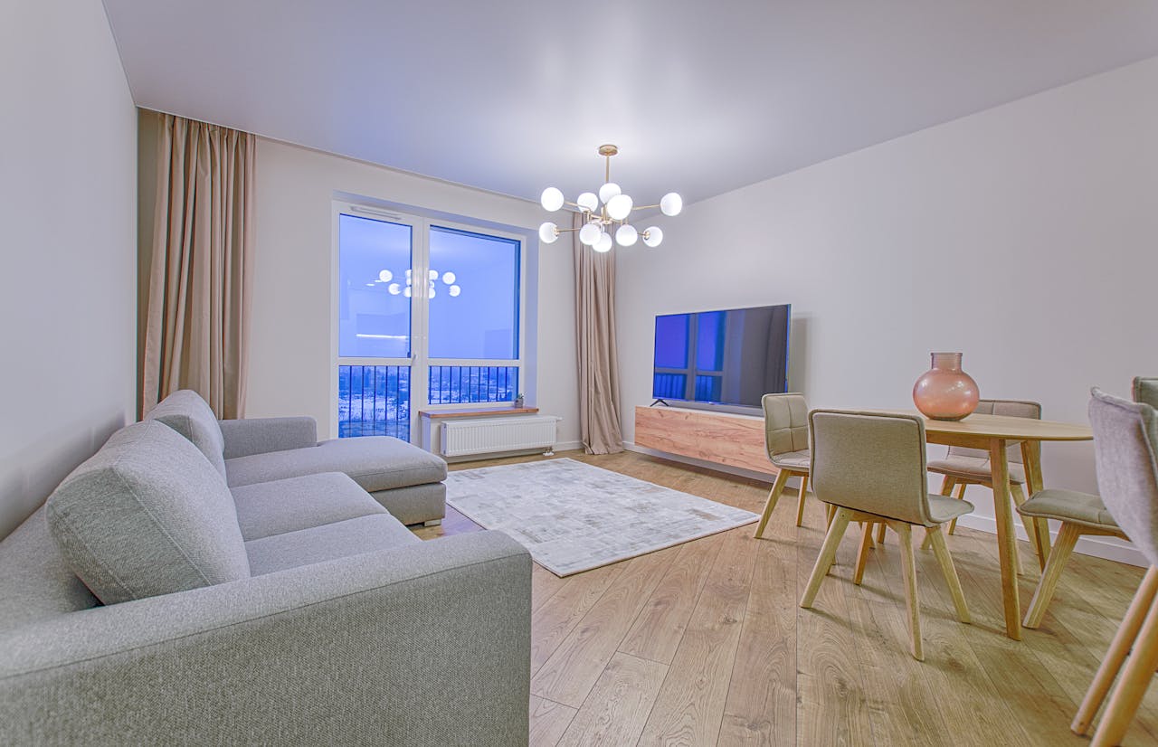 A spacious modern living room featuring stylish furnishings and decor.